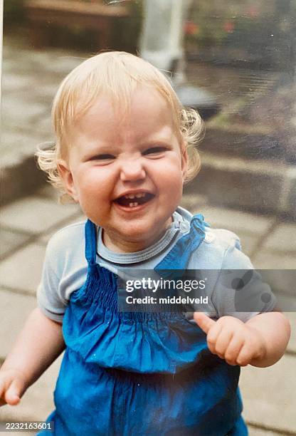 smiling baby girl in the eighties. - baby girls stock pictures, royalty-free photos & images