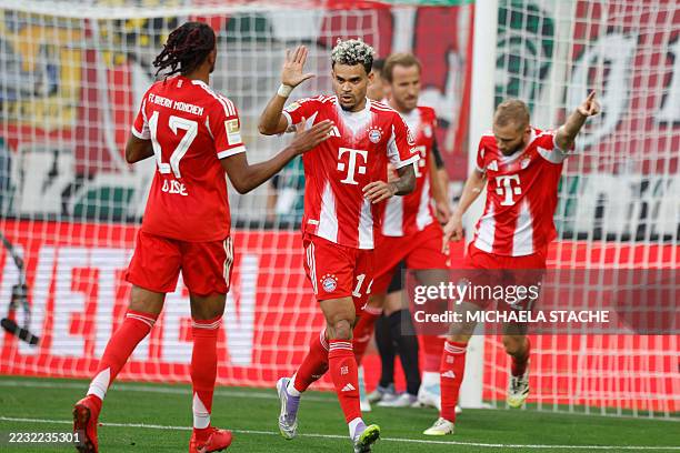 Bayern Munich's Colombian forward Luis Diaz celebrates scoring with his teammates during the German first division Bundesliga football match between...