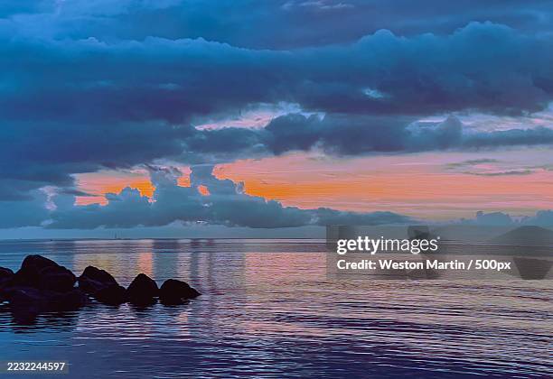 tranquil ocean sunset with dramatic clouds,east dennis,united states,usa - cape cod bay stock pictures, royalty-free photos & images