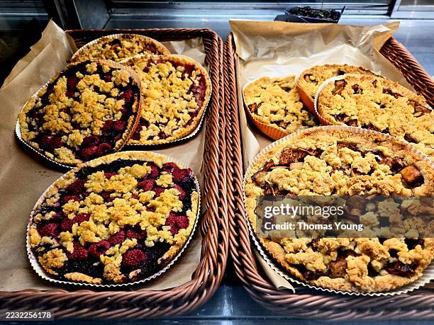 homemade berry and apple crumble pies in bakery display - blueberry pie isolated stock pictures, royalty-free photos & images