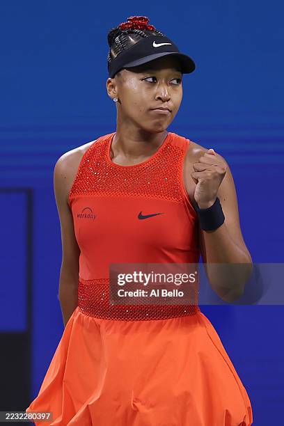 Naomi Osaka of Japan celebrates after winning match point against Greet Minnen of Belgium during their Women's Singles First Round match on Day Three...