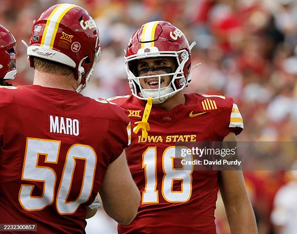 Tight end Benjamin Brahmer of the Iowa State Cyclones celebrates with teammate offensive lineman Tyler Maro of the Iowa State Cyclones after scoring...