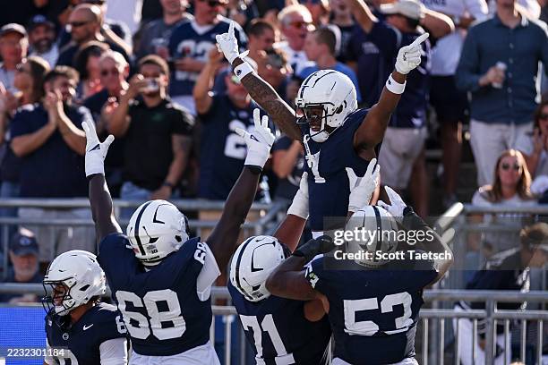 Kyron Hudson of the Penn State Nittany Lions celebrates with teammates after catching a pass for a touchdown against the Nevada Wolf Pack during the...