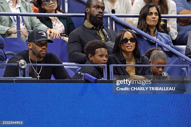 American football quarterback Russell Wilson and his wife US singer Ciara attend the women's singles third round match between Russia's Anna...