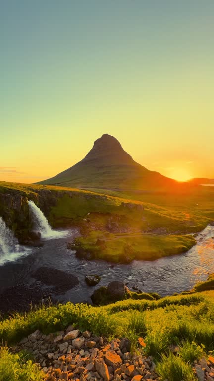 https://media.gettyimages.com/id/2232350053/video/panning-kirkjufells-golden-dawn-a-beautiful-sunrise-at-the-waterfall.jpg?b=1&s=640x640&k=20&c=fpNGUpyKIJKcUZADee31OS3R1DBqu9o71ebp5YNSP_8=