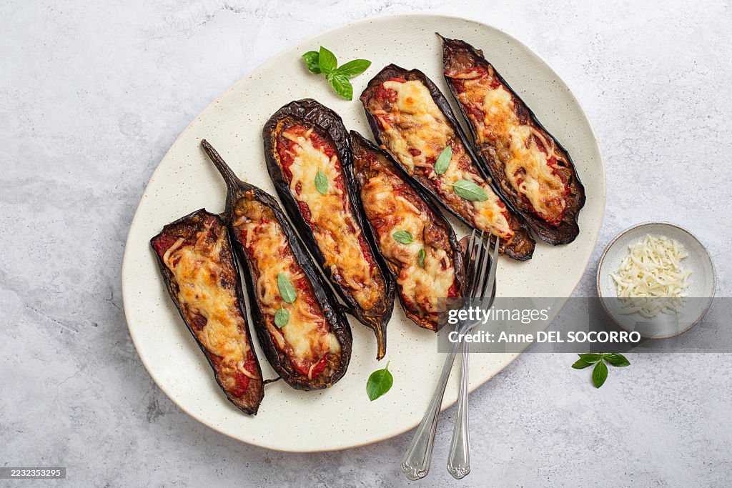 Grilled eggplant pizza with tomato sauce, mozzarella cheese and basil leaves
