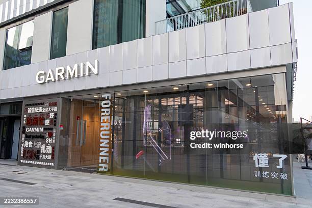 garmin watch store in shanghai, china - garmin-global-positioning-system stock pictures, royalty-free photos & images