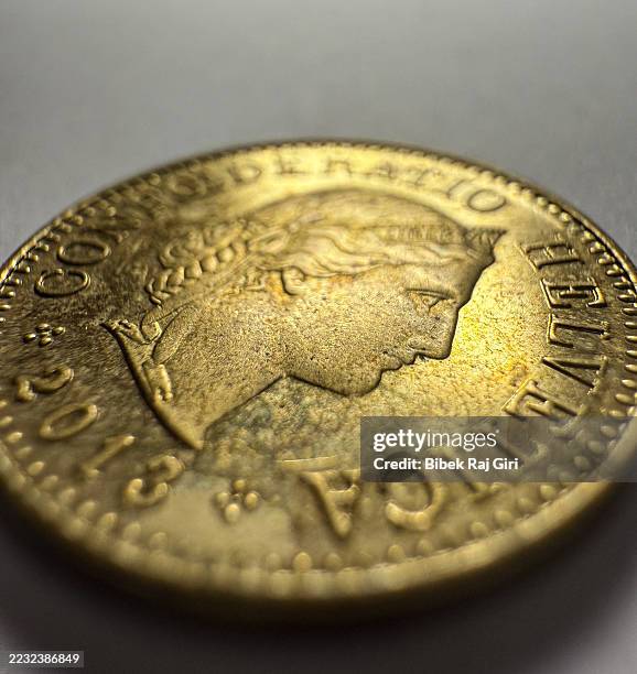 a macro image of a swiss currency - frankenmünze stock-fotos und bilder
