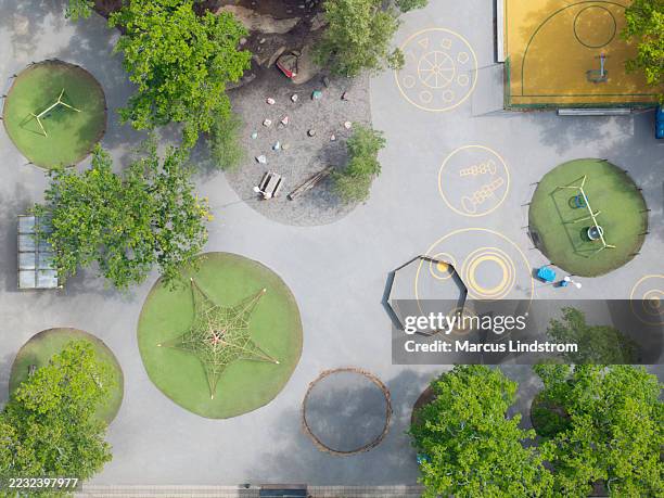 aerial view of a large schoolyard with playground equipment - skolgård bildbanksfoton och bilder