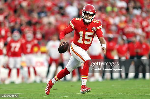 Quarterback Patrick Mahomes of the Kansas City Chiefs scrambles during the first quarter of the NFL Preseason 2025 game against the Chicago Bears at...