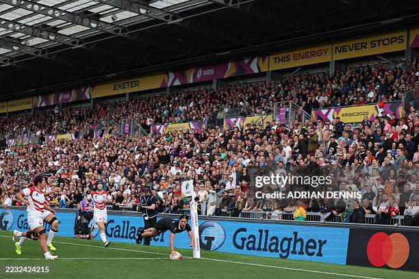 New Zealand's full back Braxton Sorensen-McGee sores a try during the Women's Rugby World Cup pool C match between New Zealand and Japan at Sandy...