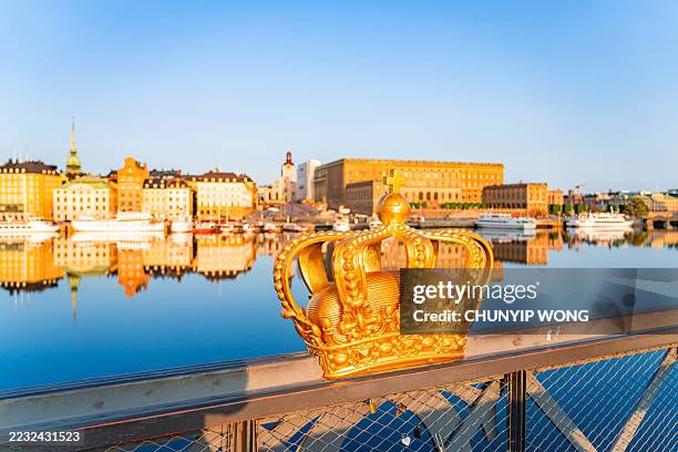 golden crown ornament symbolizing swedish monarchy in stockholm - the stockholm palace stock pictures, royalty-free photos & images