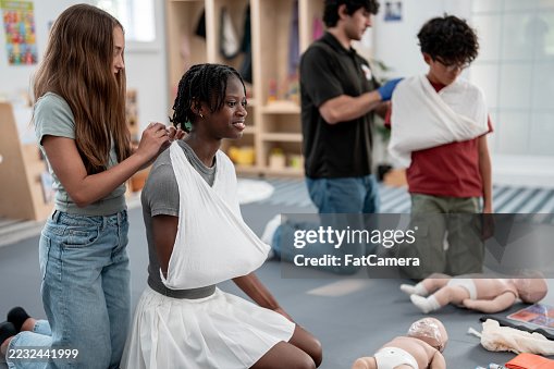 Children Practicing First Aid Techniques During Classroom Training Children Practicing First Aid Techniques During Classroom Training