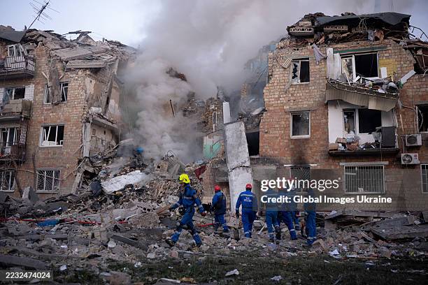 Rescuers conduct search-and-rescue operation at destroyed building after Russian drone-and-missile attack on August 28, 2025 in Kyiv, Ukraine. As a...