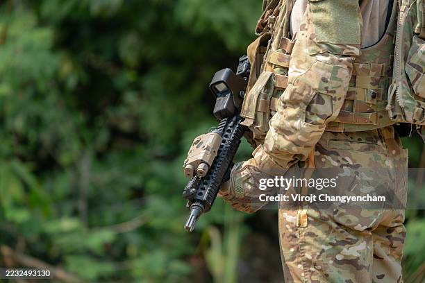 back view of female soldier training in tactical military exercise - special forces stock pictures, royalty-free photos & images