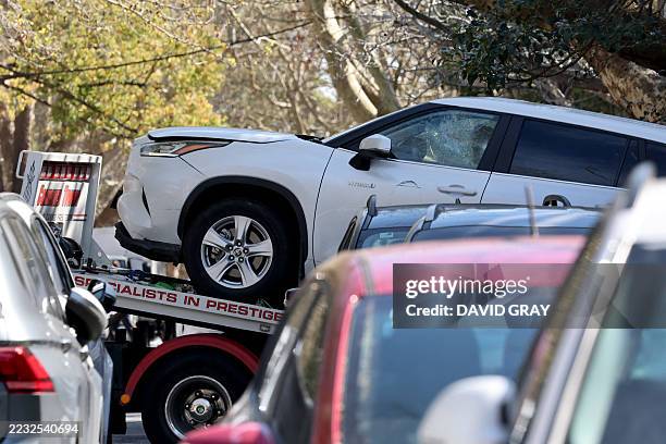 Tow truck removes a car after it was driven into the gates of the Russian consulate in Sydney on September 1, 2025. New South Wales Police said they...