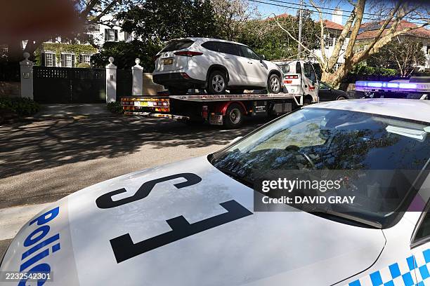 Tow truck removes a car after it was driven into the gates of the Russian consulate in Sydney on September 1, 2025. New South Wales Police said they...