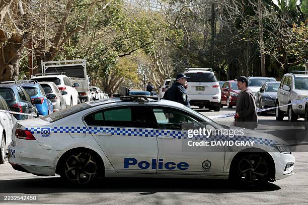 Police bloke a street after a car was driven into the gates of the Russian consulate in Sydney on September 1, 2025. New South Wales Police said they...