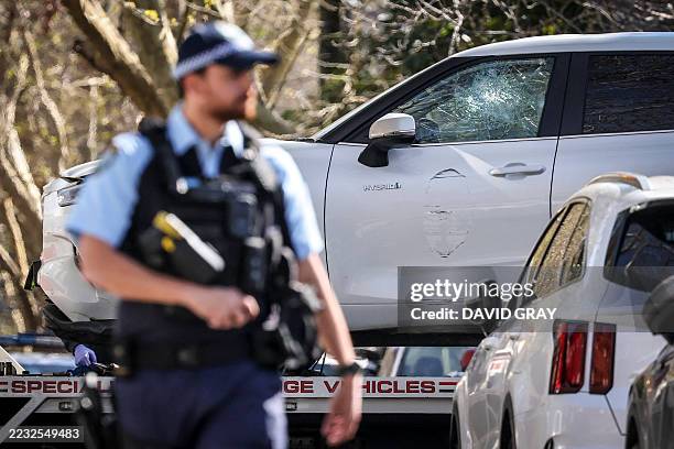 Tow truck removes a car after it was driven into the gates of the Russian consulate in Sydney on September 1, 2025. New South Wales Police said they...