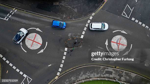 In this aerial view the flag of St George, the flag of England, is painted on a mini traffic island on August 29, 2025 in Walsall, United Kingdom. An...