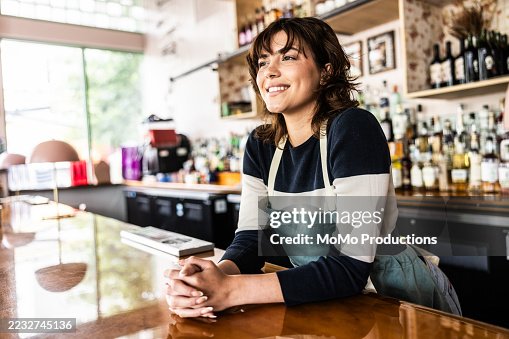 Young female restaurant manager talking inventory with digital tablet Young female restaurant manager talking inventory with digital tablet