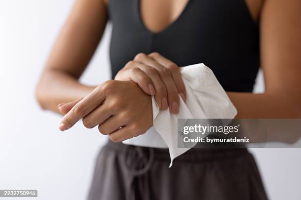 woman using wet wipes - rubbing stock pictures, royalty-free photos & images