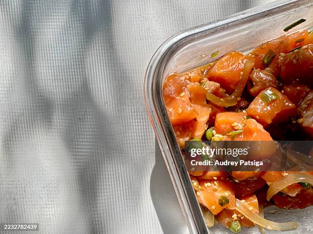 fresh salmon poke in glass prep container - marinated stock pictures, royalty-free photos & images