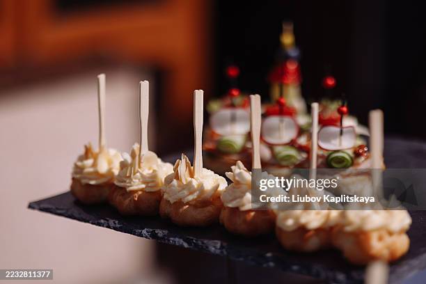 canapes with cream cheese on stone tray - posh sandwich stock pictures, royalty-free photos & images