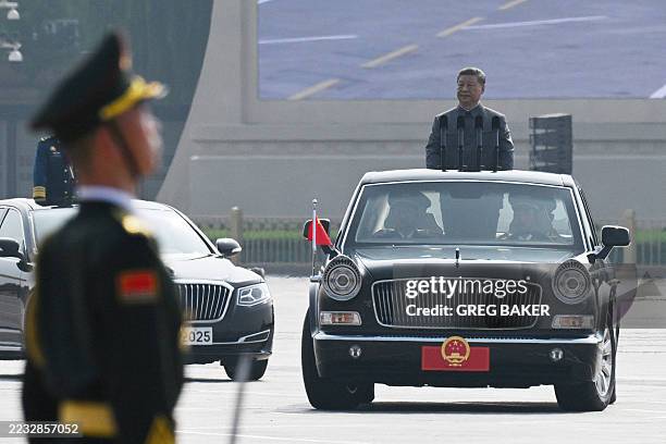 China's President Xi Jinping inspects the troops during a military parade marking the 80th anniversary of victory over Japan and the end of World War...