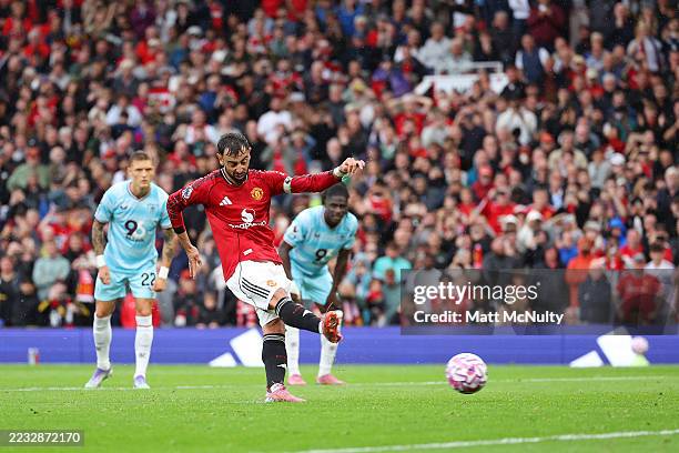 Bruno Fernandes of Manchester United scores his team's third goal from the penalty spot during the Premier League match between Manchester United and...