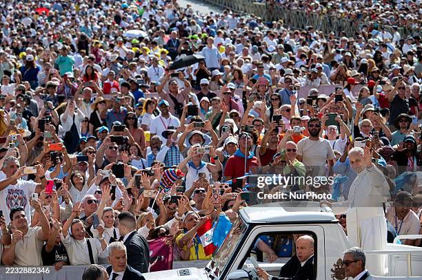 Pope Leo XIV salutes as he arrives to lead his weekly general audience at St. Peter's Square in the Vatican on September 3, 2025.