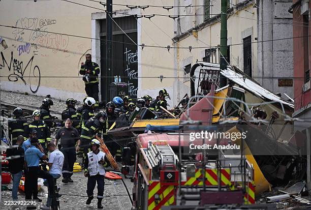 Rescuers and firefighters operate at the scene after the Gloria funicular cable railway derailed in Lisbon, Portugal, 03 September 2025. At least 15...