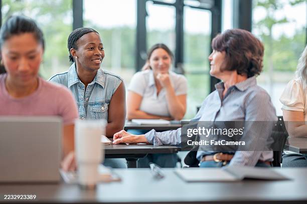 diverse group of individuals engaged in a collaborative workshop setting - new skill stock pictures, royalty-free photos & images