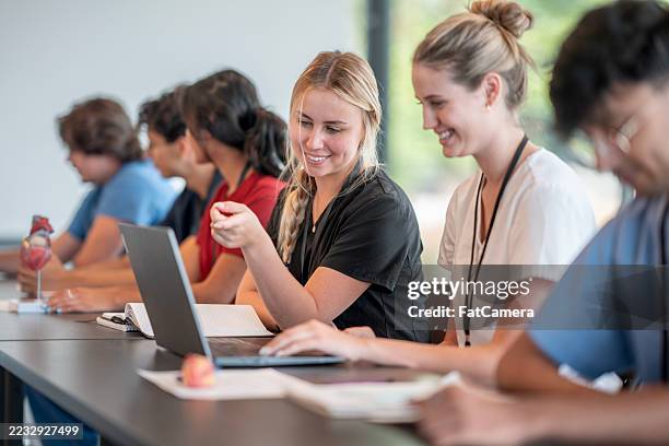medical students collaborating during a hands-on classroom study session - task force stock pictures, royalty-free photos & images