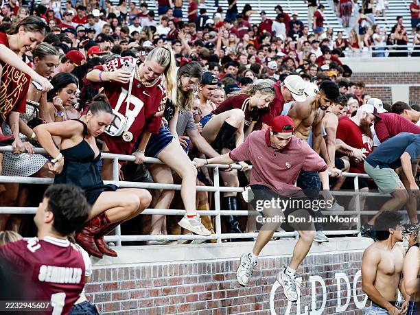 Fans of the Florida State Seminoles storm the field after the game against the Alabama Crimson Tide at Doak S. Campbell Stadium on Bobby Bowden Field...