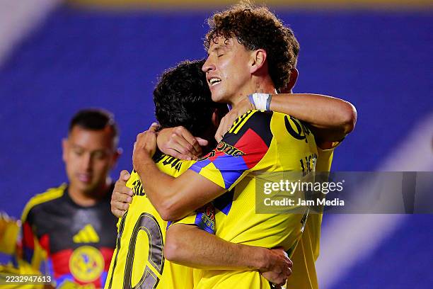 Igor Lichnovsky of America celebrates with teammates after scoring the team's first goal during the 7th round match between America and Pachuca as...