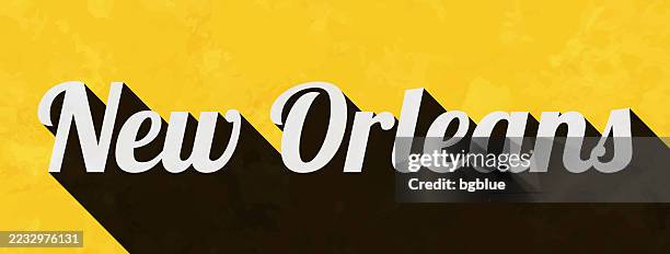 bildbanksillustrationer, clip art samt tecknat material och ikoner med new orleans - text with long shadow on textured yellow background - new orleans