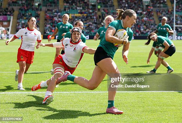 Anna McGann of Ireland runs with the ball before scoring her team's seventh try during the Women's Rugby World Cup 2025 Pool C match between Ireland...