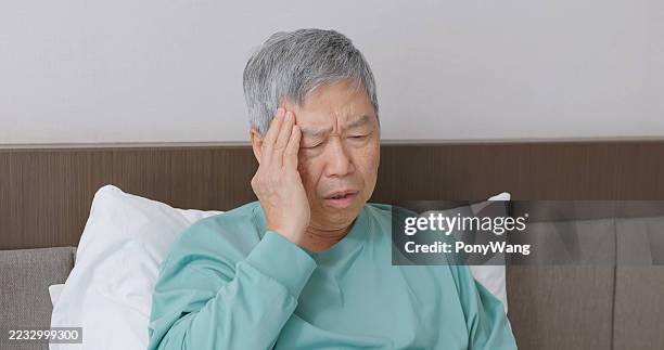 asian elderly get cold headache at home - elderly dizzy stock pictures, royalty-free photos & images