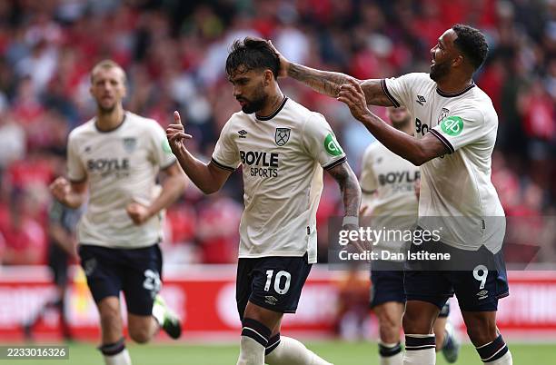 Lucas Paqueta of West Ham United celebrates scoring his team's second goal from the penalty spot with teammate Callum Wilson during the Premier...
