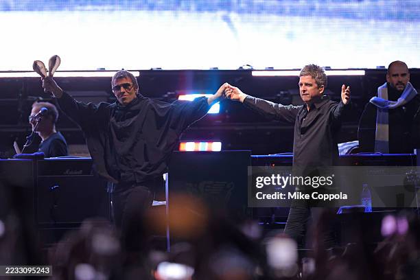 Liam Gallagher and Noel Gallagher walk out together during their Oasis Live ’25 world tour at MetLife Stadium on August 31, 2025 in East Rutherford,...