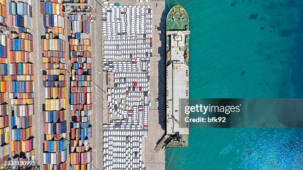 aerial top view of large car transporter ship or ocean going vehicle carrier ship loaded with cars docked in the port of izmit. ready for loading and unloading operation. - car transporter stock pictures, royalty-free photos & images