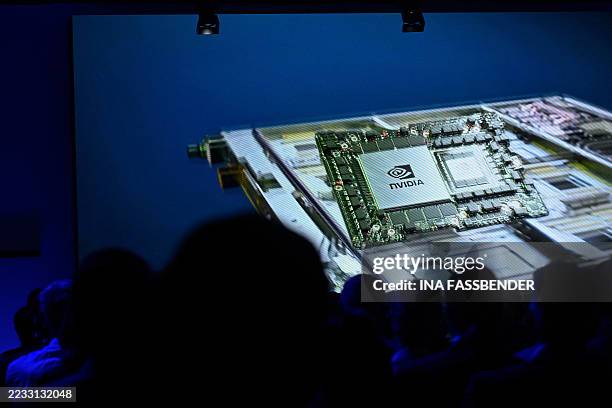 Chip of Nvidia is seen on screen as part of the supercomputer Jupiter during the inauguration of Europe's fastest supercomputer Jupiter on September...