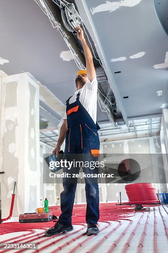 Construction engineer inspecting cheching work progress Construction engineer inspecting cheching work progress