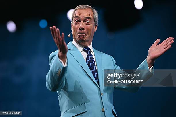 Reform UK Leader Nigel Farage reacts while performing on the first day of the Reform UK party conference at the NEC Birmingham, central England, on...