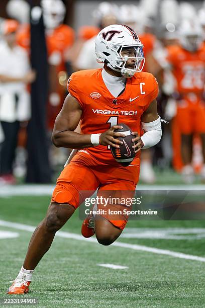 Kyron Drones of the Virginia Tech Hokies looks to pass the ball during the AFLAC Kickoff Game against the South Carolina Gamecocks on August 31, 2025...