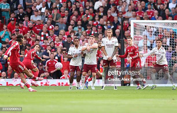 Dominik Szoboszlai of Liverpool scores his sides first goal from a direct freekick during the Premier League match between Liverpool and Arsenal at...