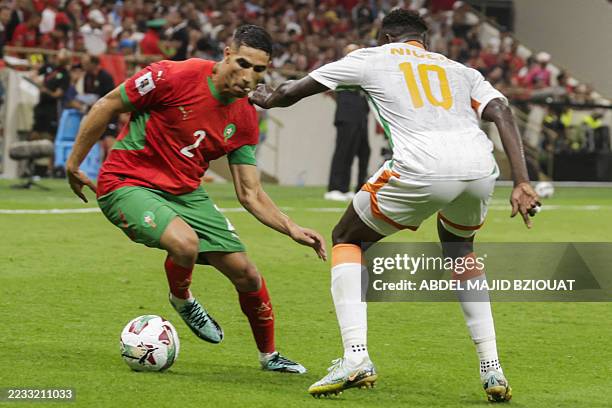 Niger's forward Victorien Adebayor marks Morocco's defender Achraf Hakimi during the FIFA World Cup 2026 Group E African qualification football match...