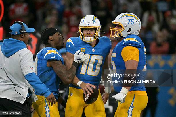 Los Angeles Chargers' quarterback Justin Herbert celebrates with teammates after scoring during the NFL game between the Kansas City Chiefs and Los...