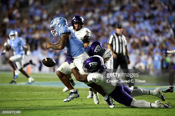 Jonathan Bax of the TCU Horned Frogs sacks Gio Lopez of the North Carolina Tar Heels and causes a fumble during the second half of the game at Kenan...